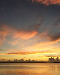 Scenic view of calm lake at sunset