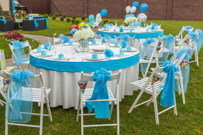 Chairs and tables on field