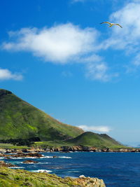 Scenic view of sea against cloudy sky