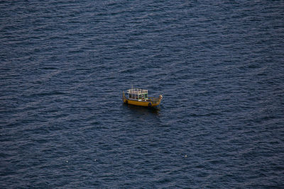 High angle view of boat sailing on sea