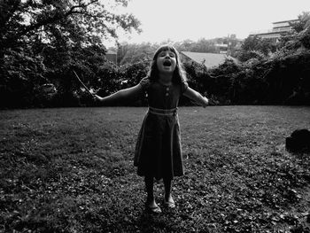 Full length of woman standing on field