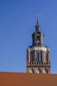 Low angle view of building against clear blue sky