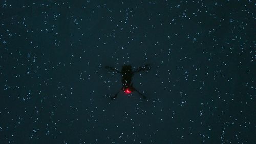 View of person in the sky at night