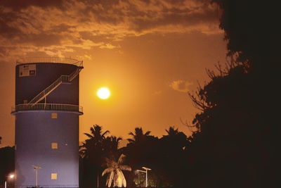 Low angle view of silhouette building against sky during sunset