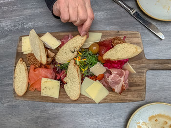 High angle view of person preparing food on cutting board