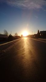 Road against sky at sunset