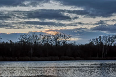 Scenic view of lake against sky during sunset