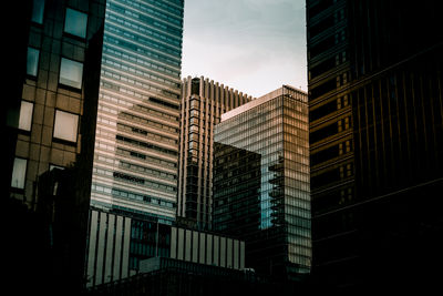 Low angle view of skyscrapers against sky