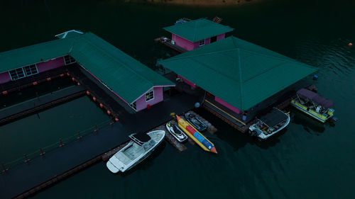 High angle view of boats moored at night