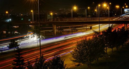 High angle view of light trails on road at night