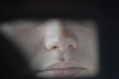 Close-up portrait of young woman with eyes closed