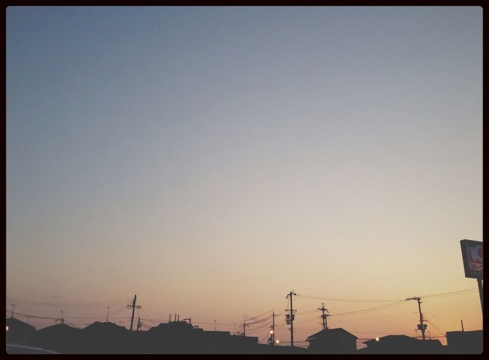 clear sky, copy space, silhouette, electricity pylon, sunset, power line, low angle view, electricity, connection, transfer print, fuel and power generation, power supply, technology, auto post production filter, sky, dusk, nature, outdoors, tranquility, orange color