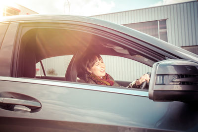 Woman sitting in car