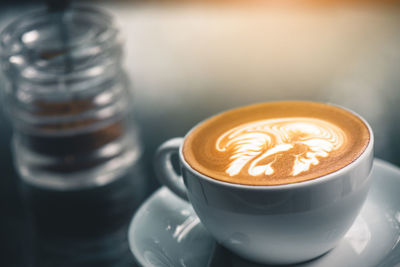 Close-up of coffee served on table