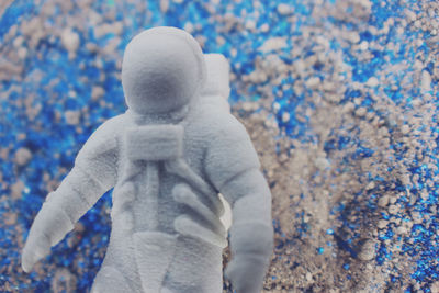 Close-up of person standing on snow covered land