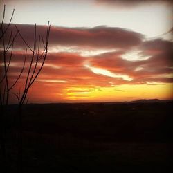 Scenic view of landscape against sky during sunset