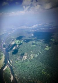 Aerial view of landscape and sea against sky