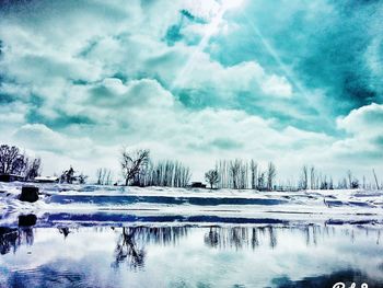 Scenic view of lake against sky during winter