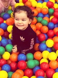 Portrait of smiling boy playing with ball