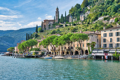 Panoramic view of trees and buildings against sky