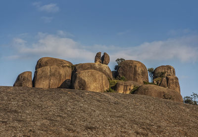 Low angle view of rock formations against blue sky - pedra grande atibaia