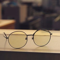 Close-up of eyeglasses on table