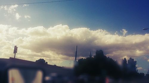 Low angle view of building against cloudy sky