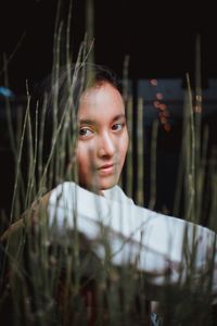 Portrait of young woman looking at camera