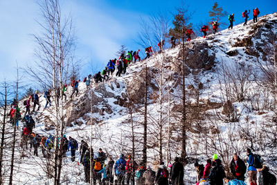 Group of people on snow covered landscape