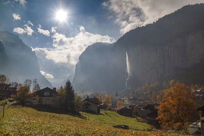 Panoramic view of trees and buildings against sky