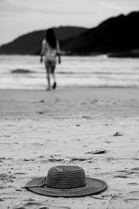 Man with umbrella on beach