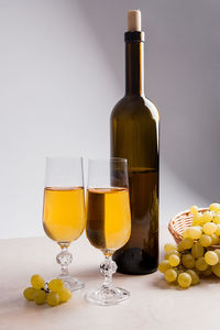 Glass of bottles on table