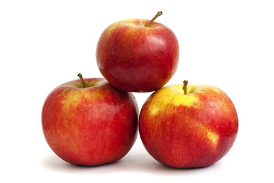 Close-up of apples against white background