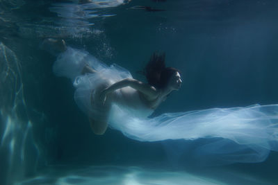 Woman swimming in sea