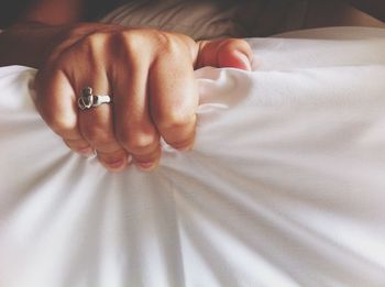 Close-up of woman lying on bed