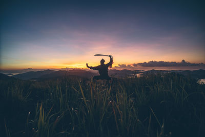 Scenic view of landscape against sky at sunset