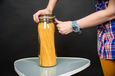 Midsection of woman holding ice cream