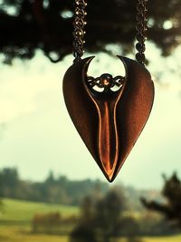 Close-up of heart shape against sky