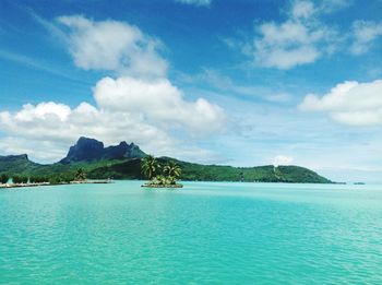 Scenic view of sea against cloudy sky