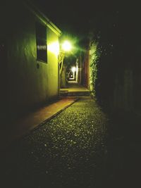 View of illuminated street at night