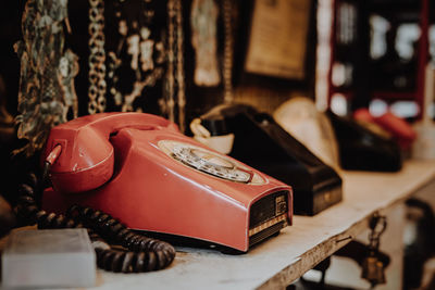Close-up of old-fashioned landline phones on table