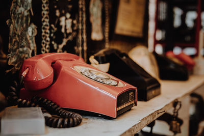 Close-up of telephone booth on table