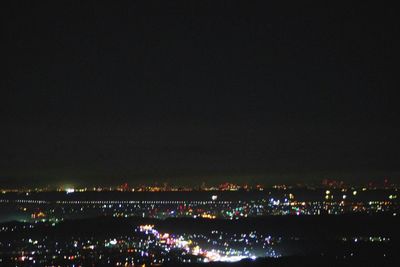 Illuminated cityscape at night