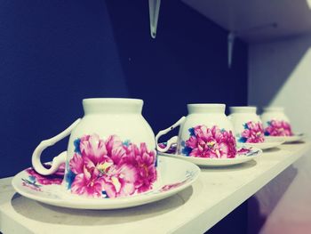 Close-up of pink flowers on table