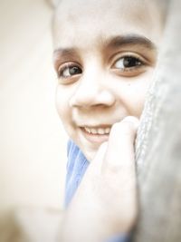 Close-up portrait of smiling young woman