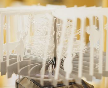 Close-up of curtain hanging on table