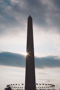 Low angle view of tower against sky during sunset