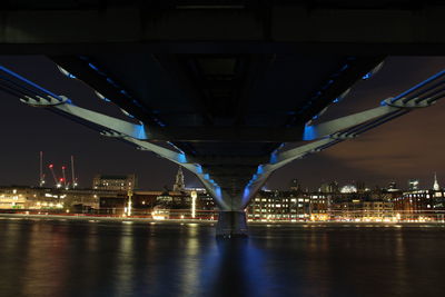 Low angle view of suspension bridge at night