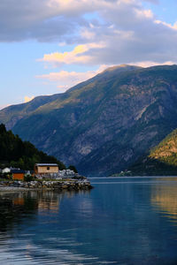 Scenic view of lake and mountains against sky