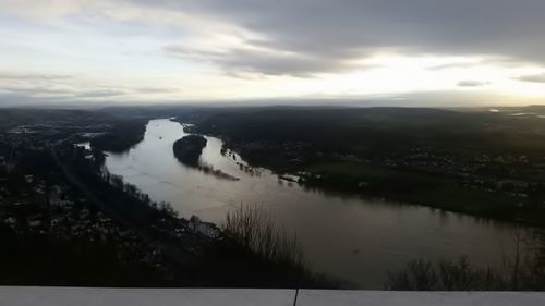 Scenic view of river against sky during sunset